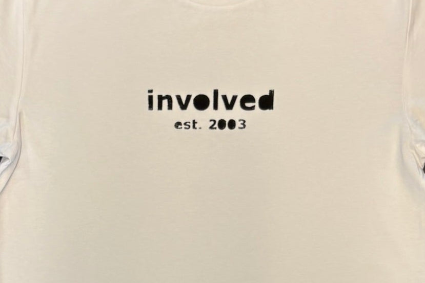 White t-shirt with 'involved est 2003' text on a black background